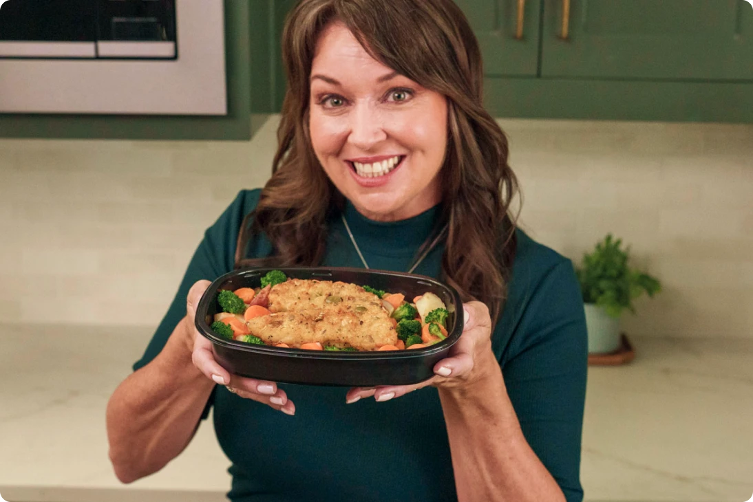Laura holding chicken dish