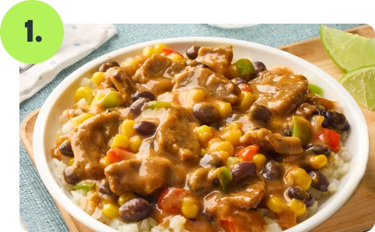 Prepared South Beach Living Beef Taco Bowl with beef, riced cauliflower, black beans, corn, and vegetables in sauce.