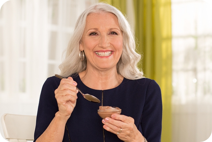 Elaine eating pudding